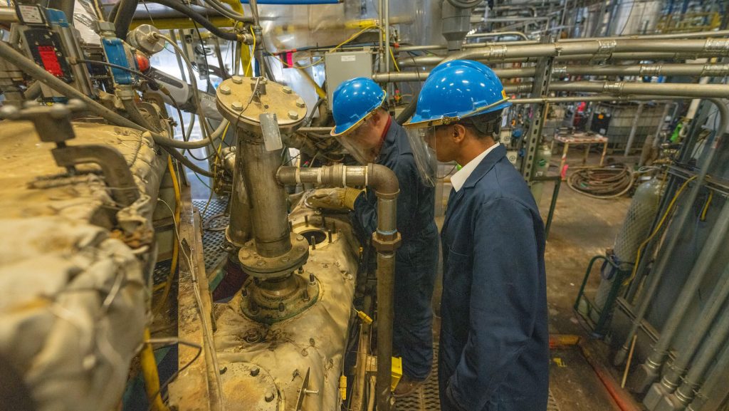 A photo of two people working in a lab