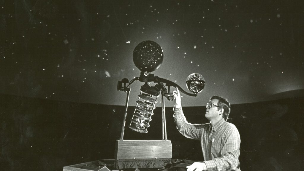 A photo of an astronomer with equipment