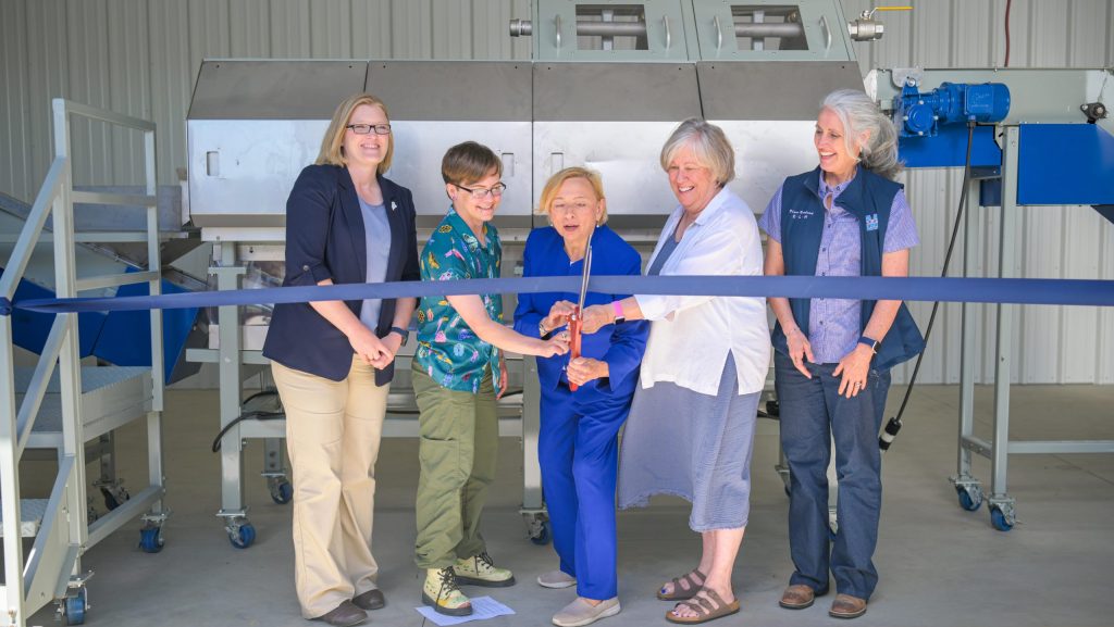 A photo of Gov. Janet Mills, Joan Ferrini-Mundy and others at a ribbon cutting