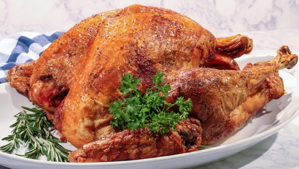A photo of a cooked turkey on a plate.